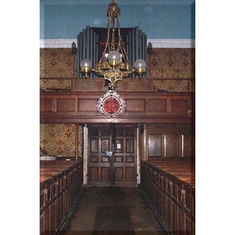 the modern church -- the top of the modern font is visible at the back (west end) of the left (south) bank of pews