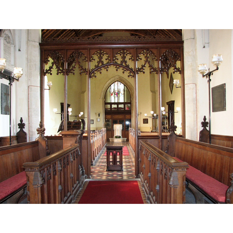 the baptismal font at the back (west end)