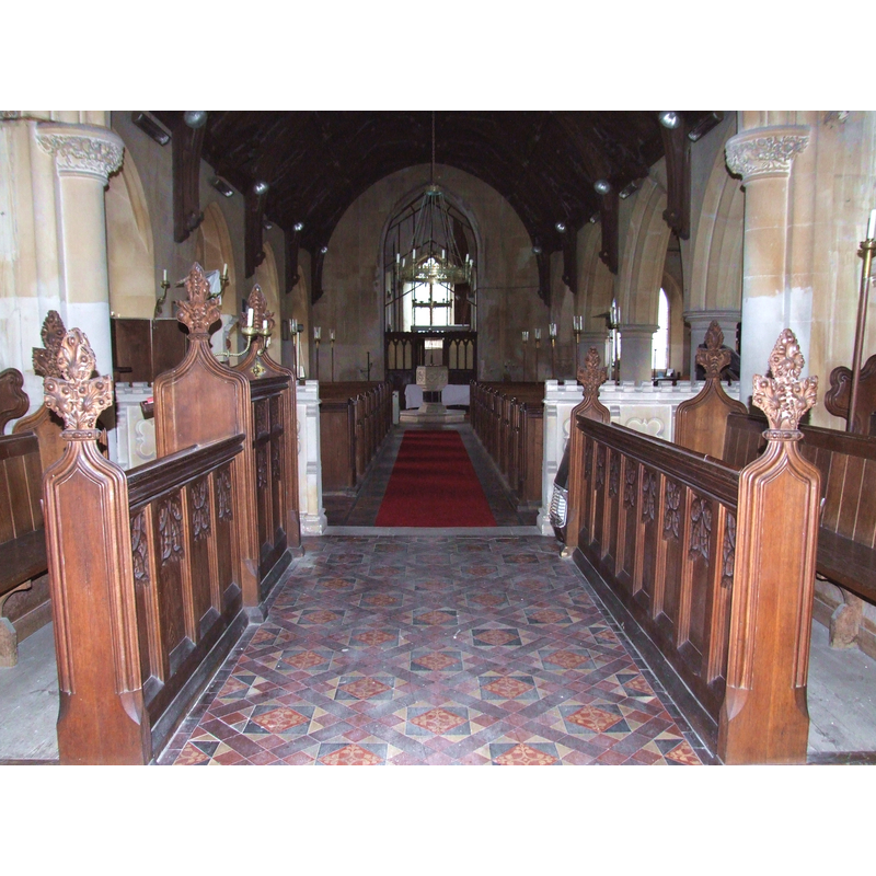 the modern font at the back (west end), centre aisle