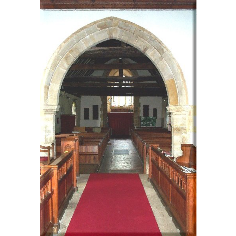 view from inside the chancel; the basin of the modern font is visible at the back (west end), left (south side)