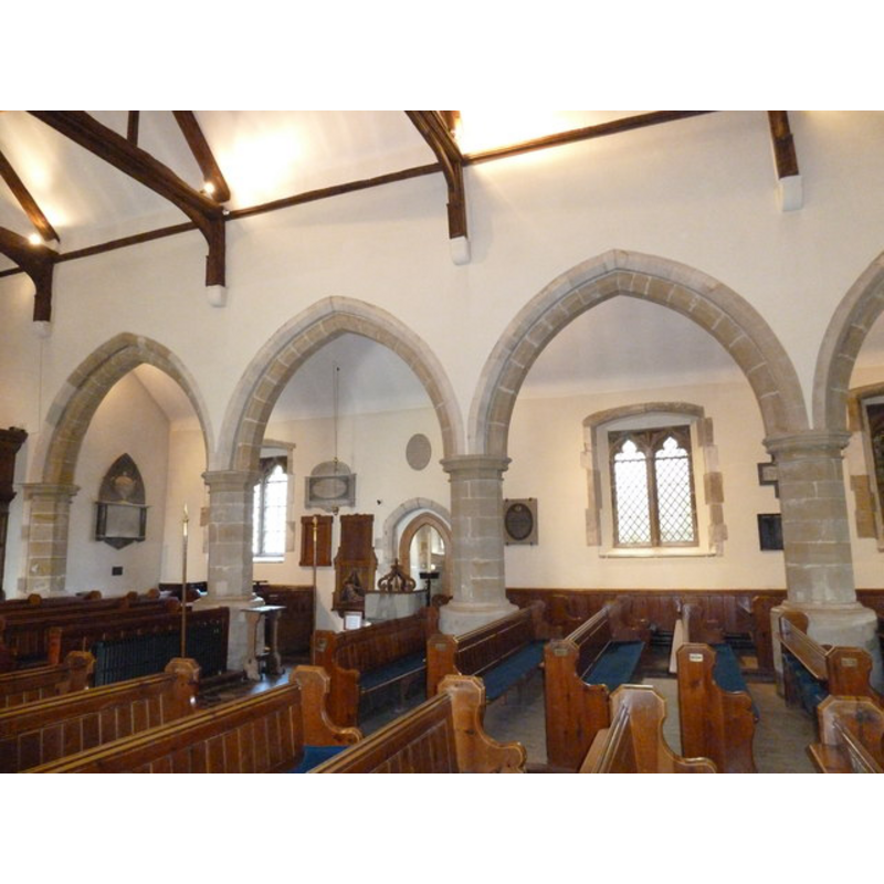 the modern font and cover between two pillars of the north arcade