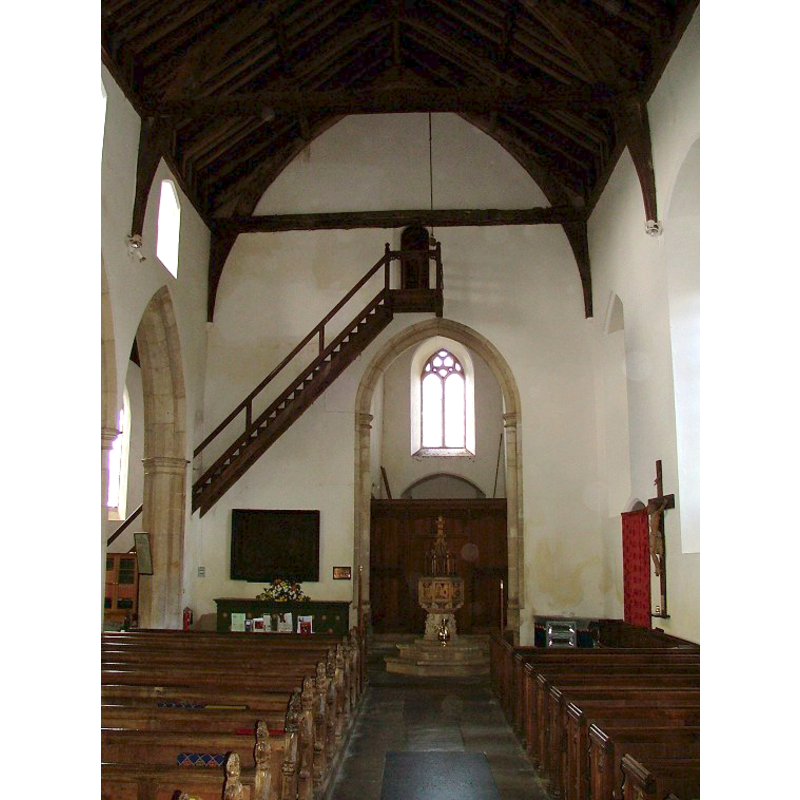 the font and cover at the west end, centre aisle
