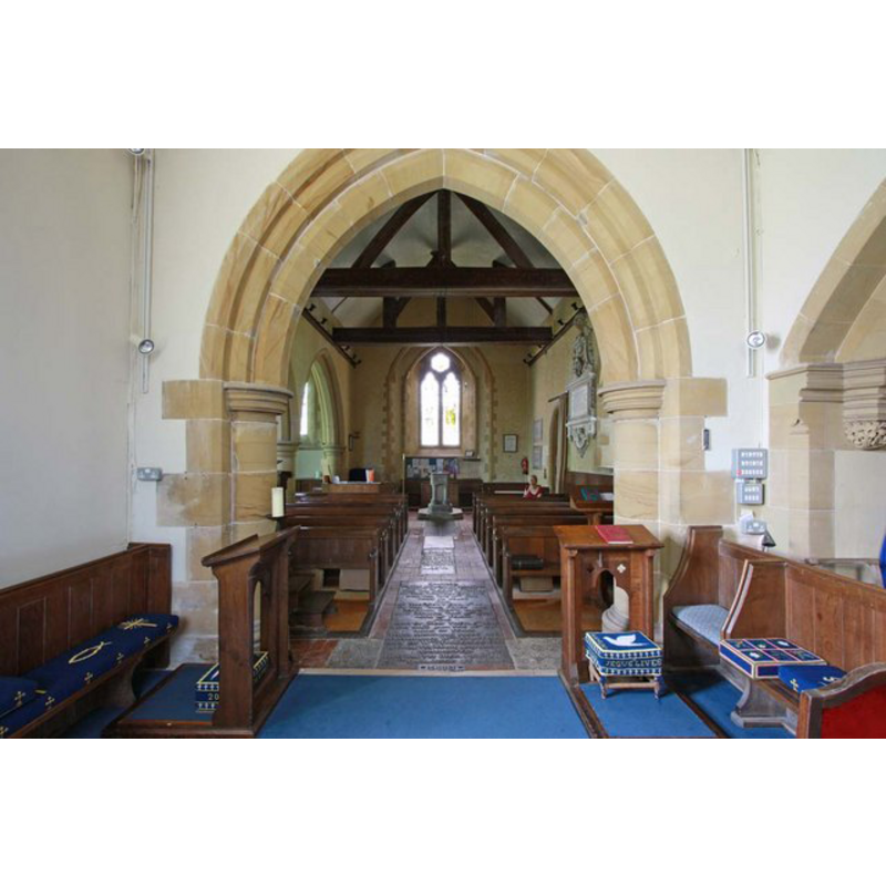 looking west from inside the chancel; the modern font is at the west end, centre aisle