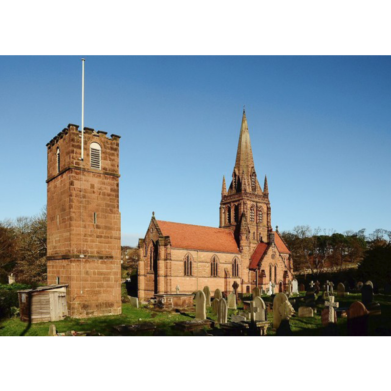 the restored tower from the old church on the left; the modern church on the right