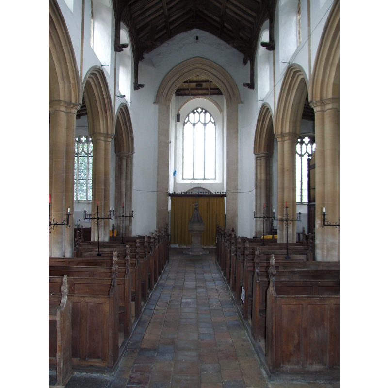 the font and cover at the west end, centre aisle