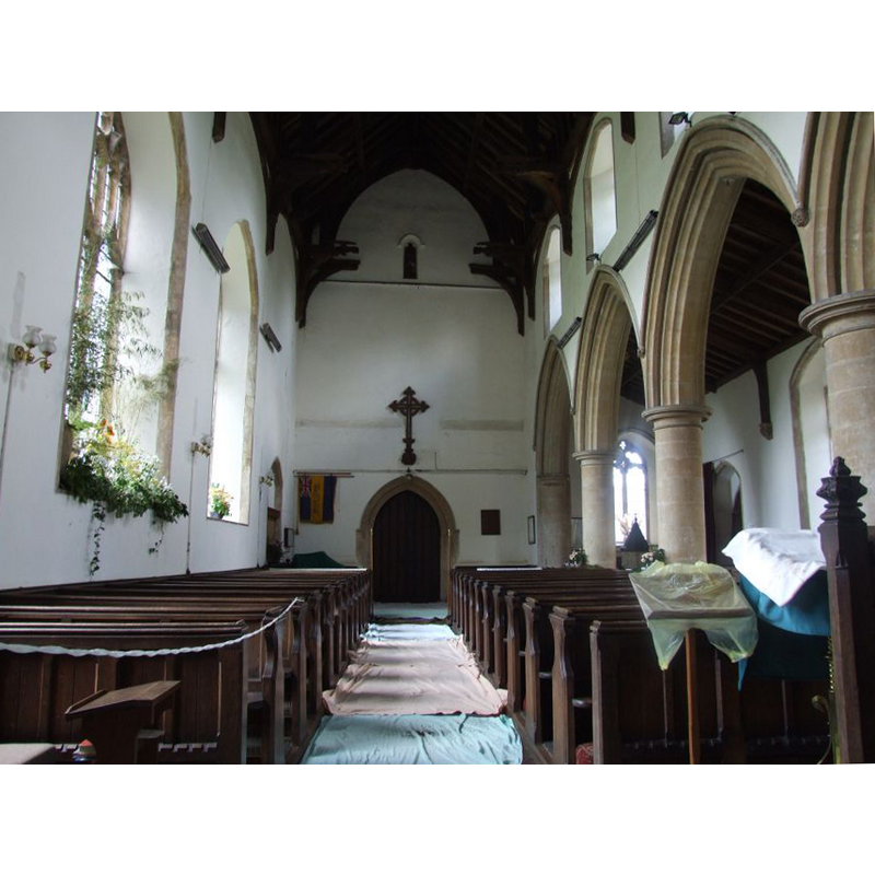 the top of the font and cover is visible through the north arcade, in the northwest corner of the north aisle
