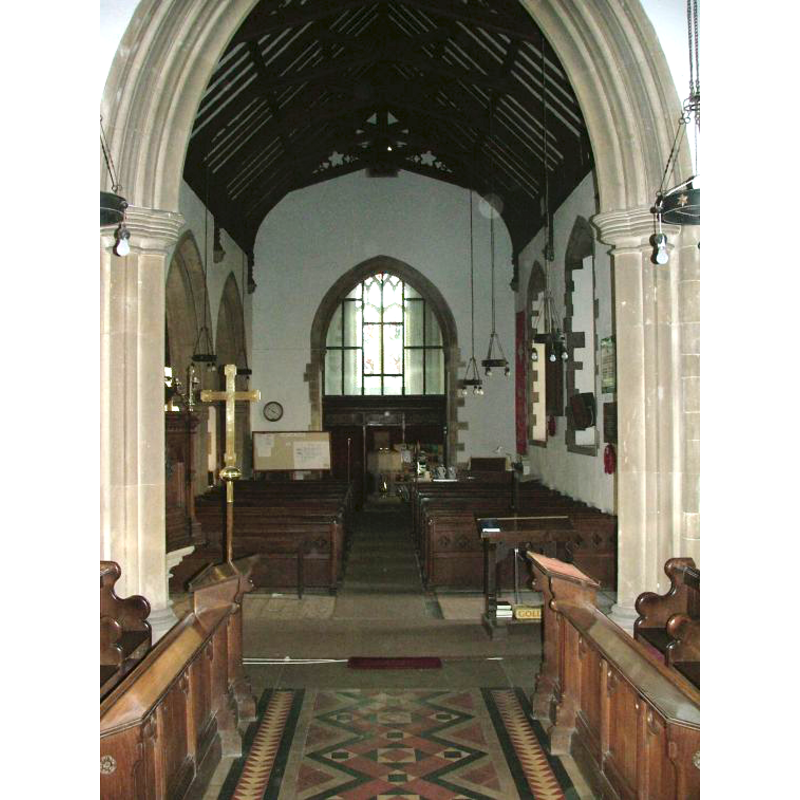 the modern font visible at the west end, centre aisle