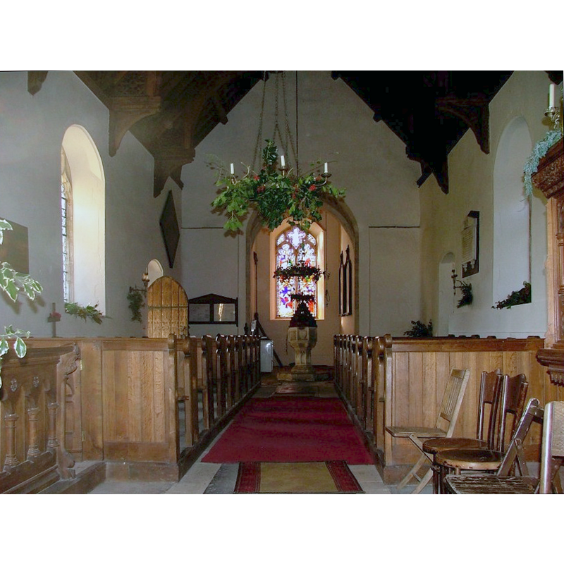 the font and cover at the west end, centre aisle
