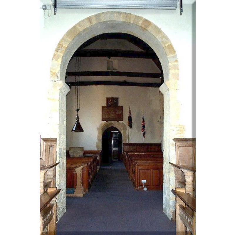 the font and cover on the left (south) side -- photograph taken from inside the chancel