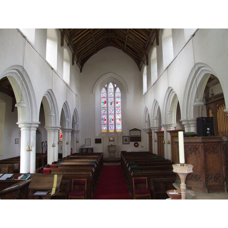 the font and cover at the west end, centre aisle