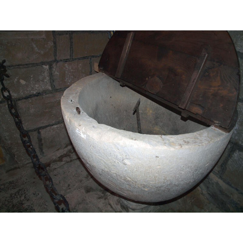 showing the hinged cover and the anchoring staple in the upper rim of the basin