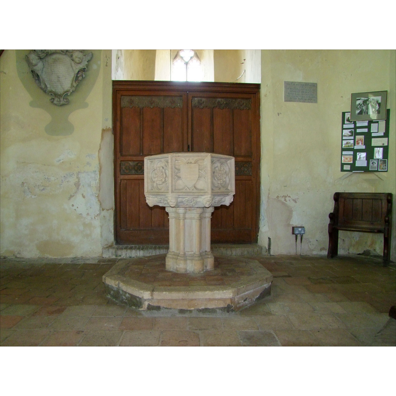 the modern font at the west end of the nave