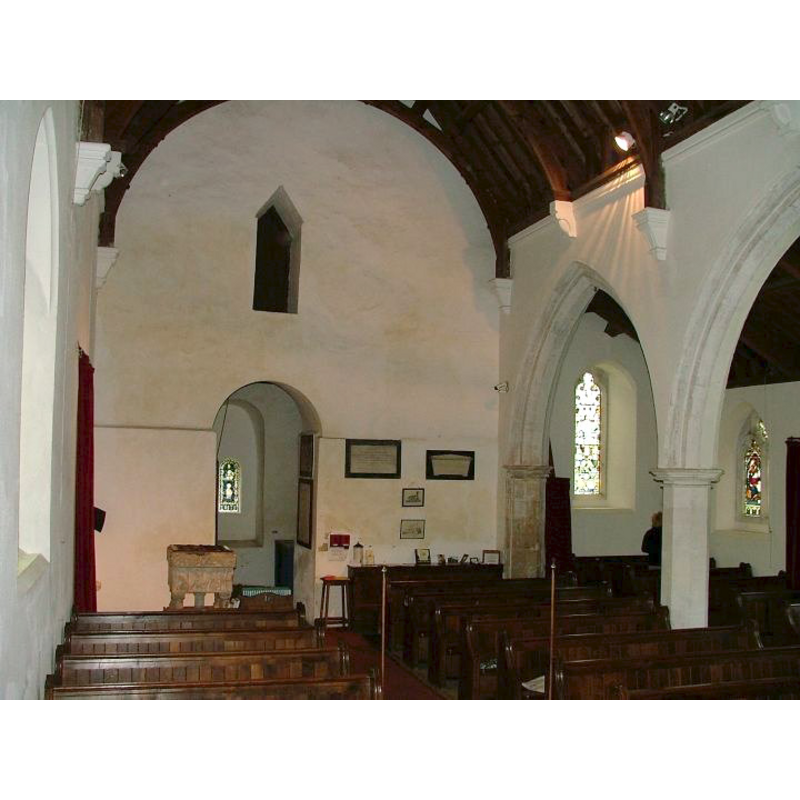 the font to the left side (south) of the tower arch