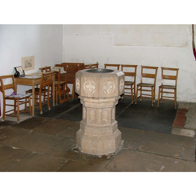 the modern font at the west end of the nave