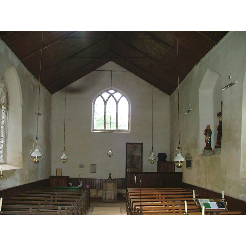the font and cover at the east end, centre aisle