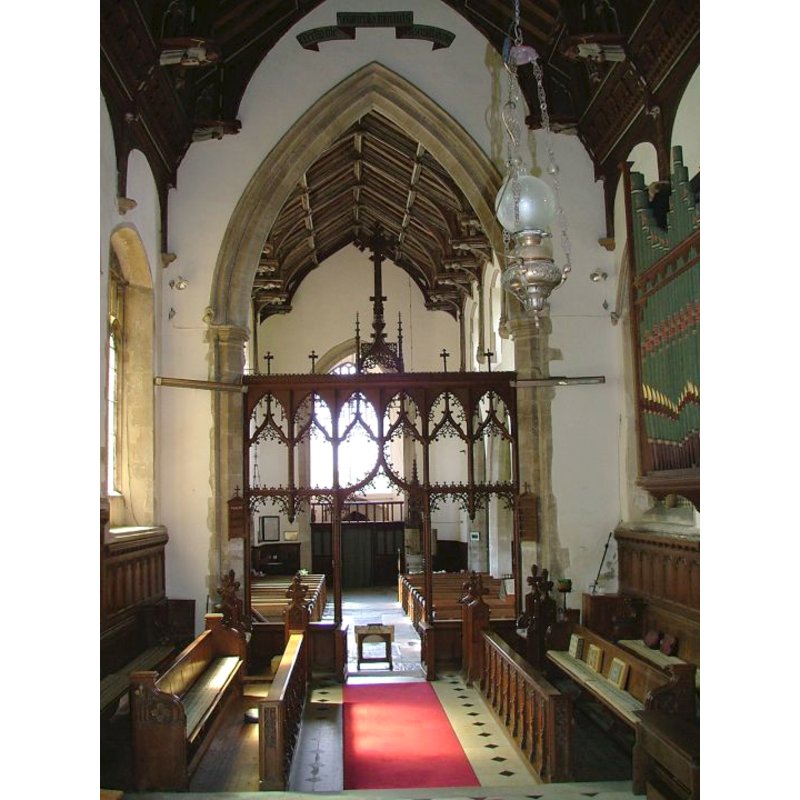 taken from inside tha chancel; showing the lovely chancel screen; the font and cover are visible at the far back, right side