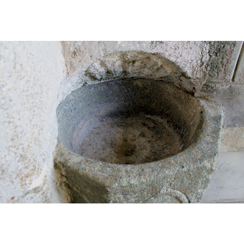 the combination of a drain hole and the stumps on the underbowl suggest a font, rather than a stoup
