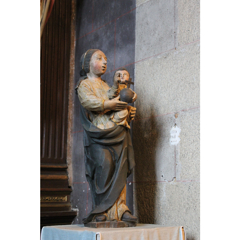 at the east end of the north aisle, to the right of the altar dedicated to Our Lady of Beauport