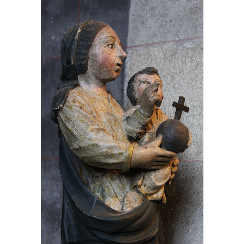 at the east end of the north aisle, to the right of the altar dedicated to Our Lady of Beauport