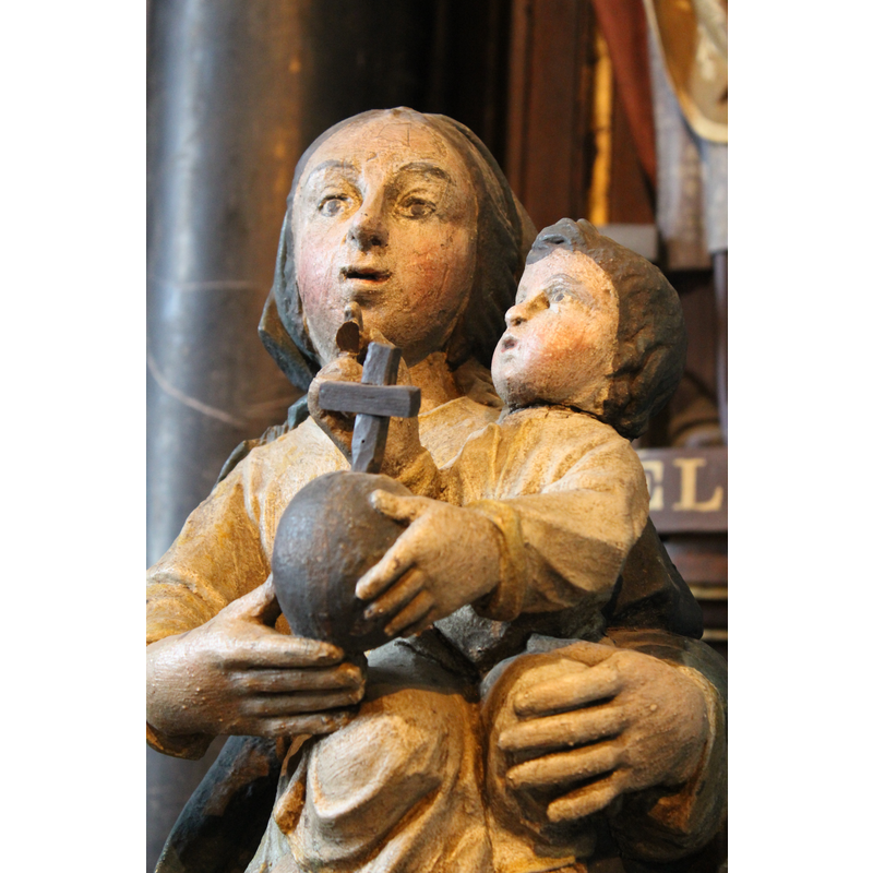 at the east end of the north aisle, to the right of the altar dedicated to Our Lady of Beauport