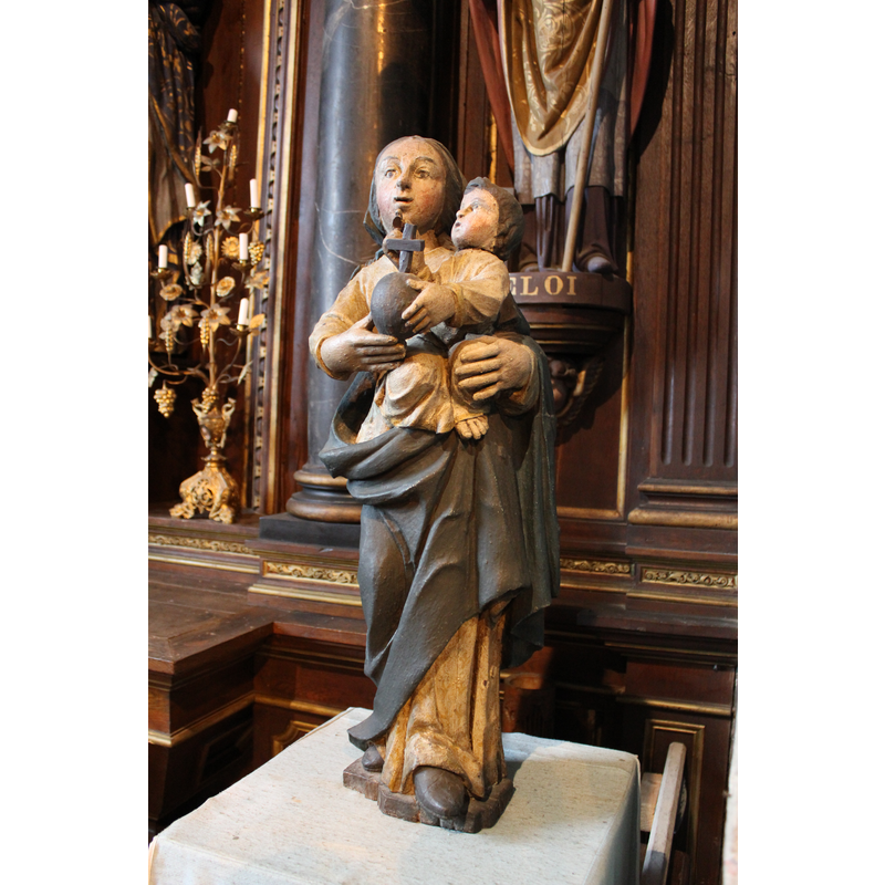 at the east end of the north aisle, to the right of the altar dedicated to Our Lady of Beauport