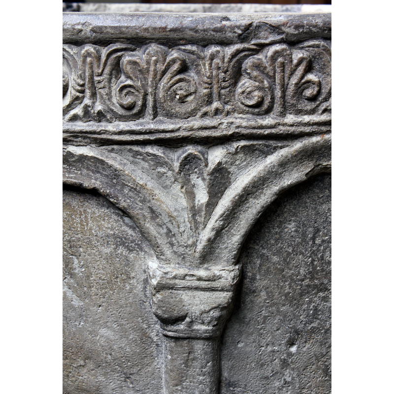 in each of the spandrels of the arcade; some much damaged or eroded