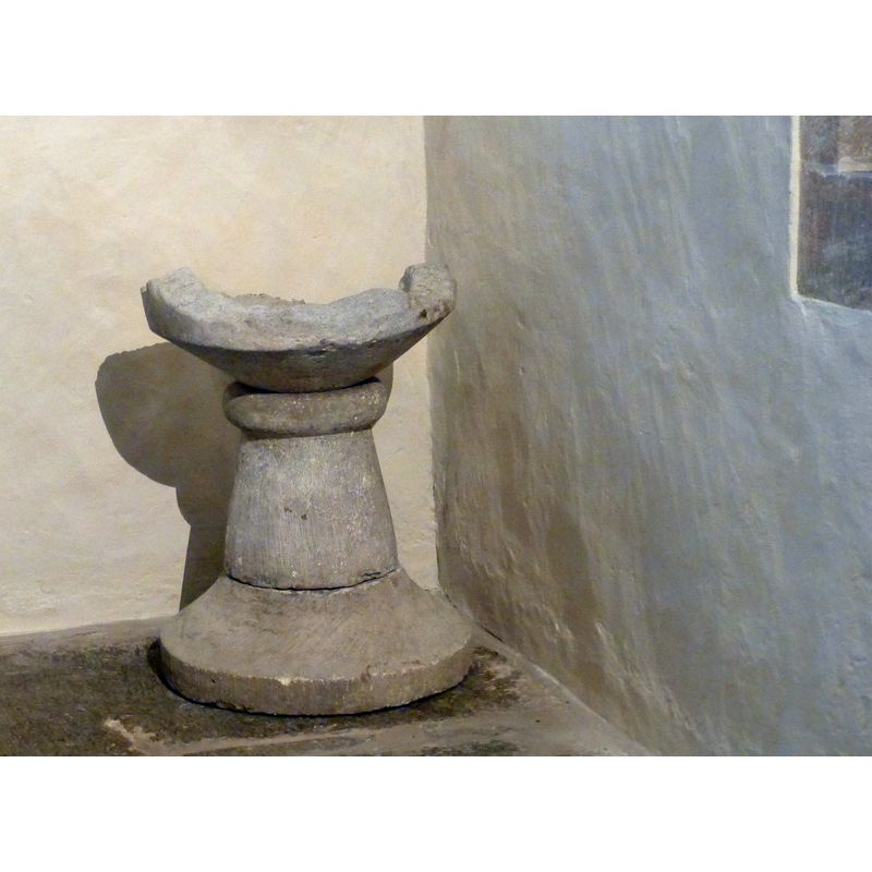 the remains of the 13th-century font