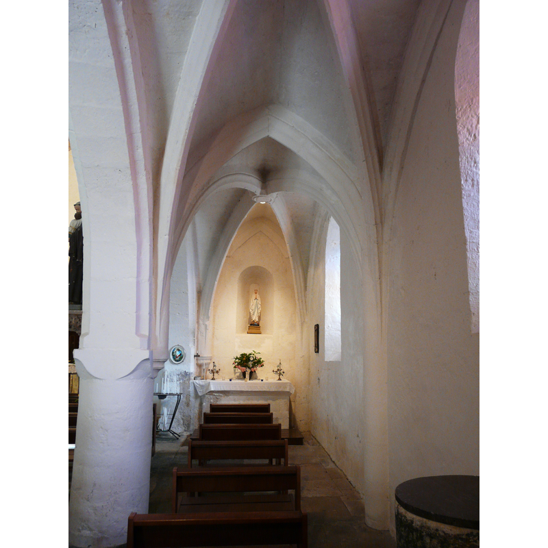 the upper part of the font and cover are visible in an alcove, foreground right