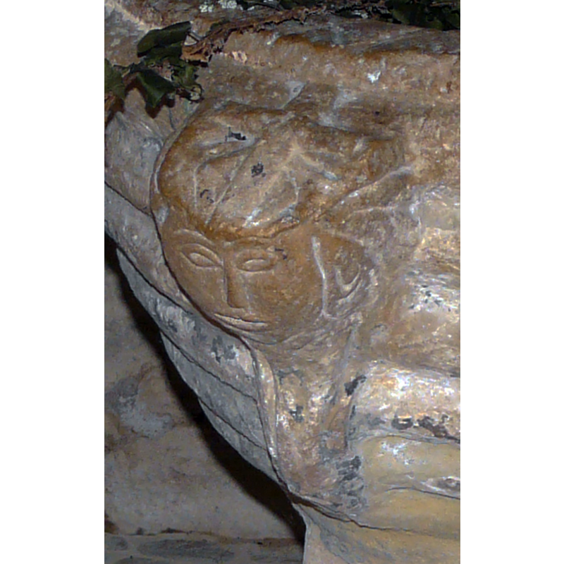 one of three? the head appears to have dressed hair; on the top of the head is carved a Latin cross