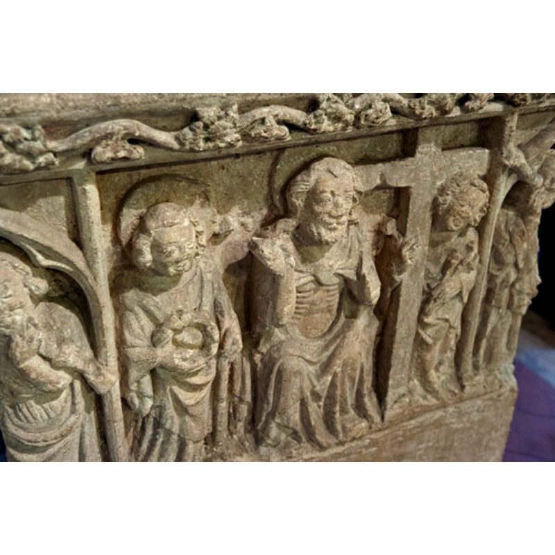 is the angel on the left holding Instruments of the Passion? a crown of thorns, instead?