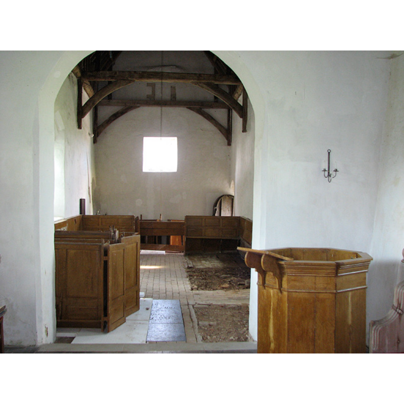 the font is not visible here; it is located behind the back of the last pew on the right (north) side, by the north door