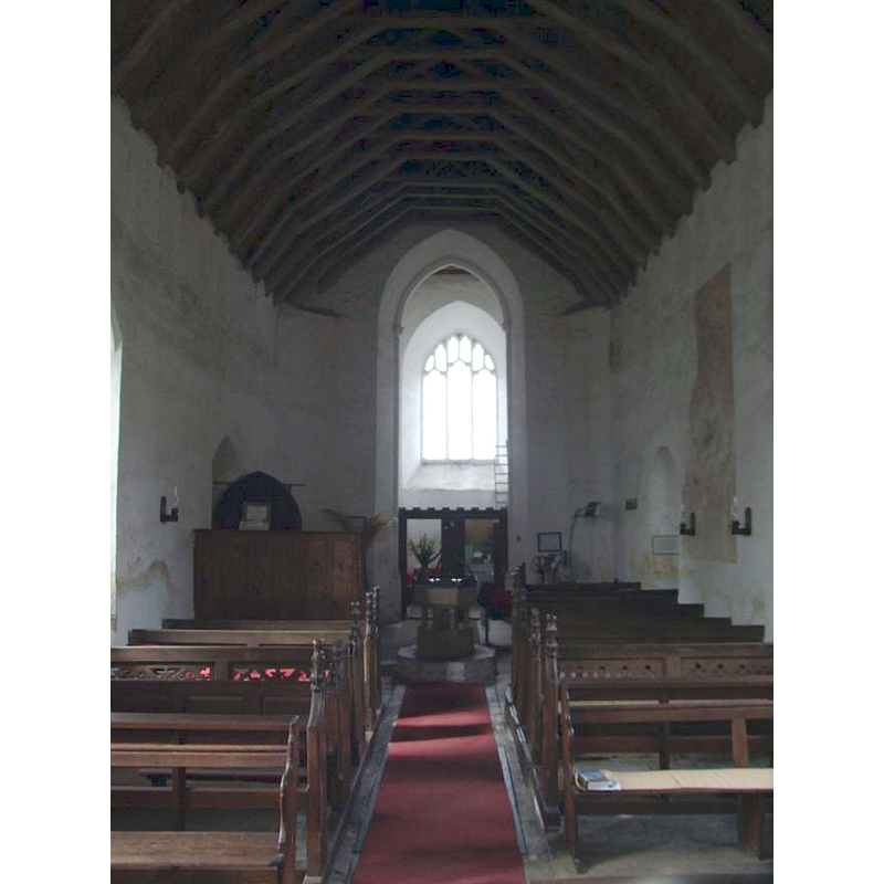 the font and cover at the west end of the center aisle