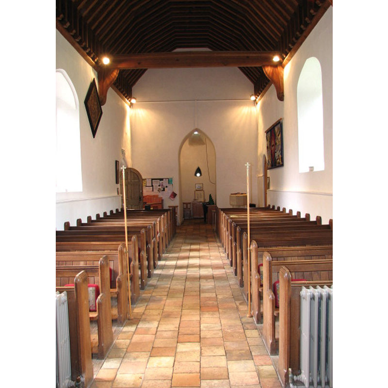 the modern font partially visible on the right (north) side, at the back (west end)