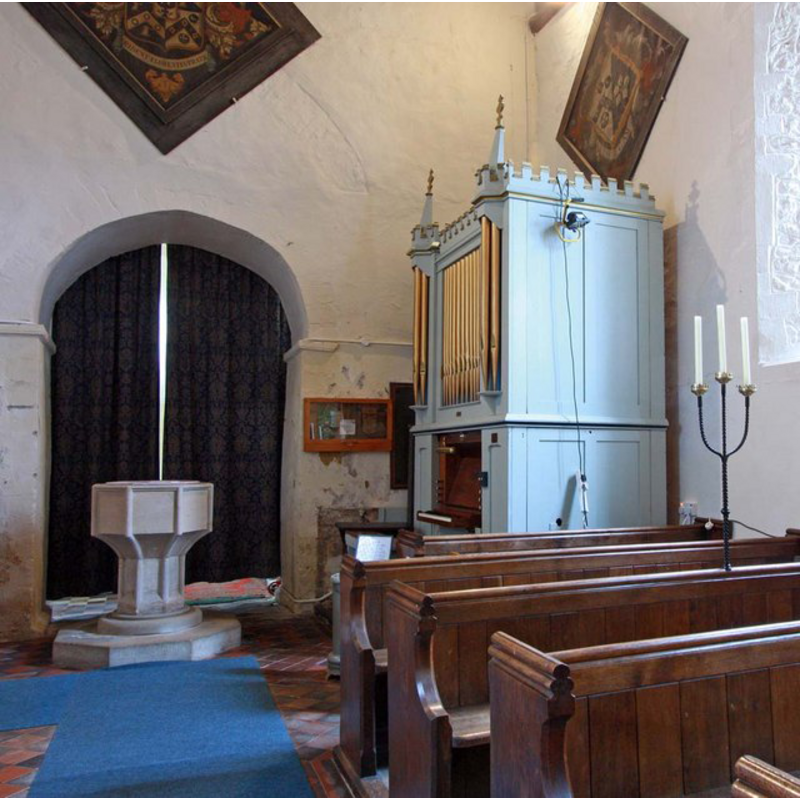 the font, the organ and the tower arch