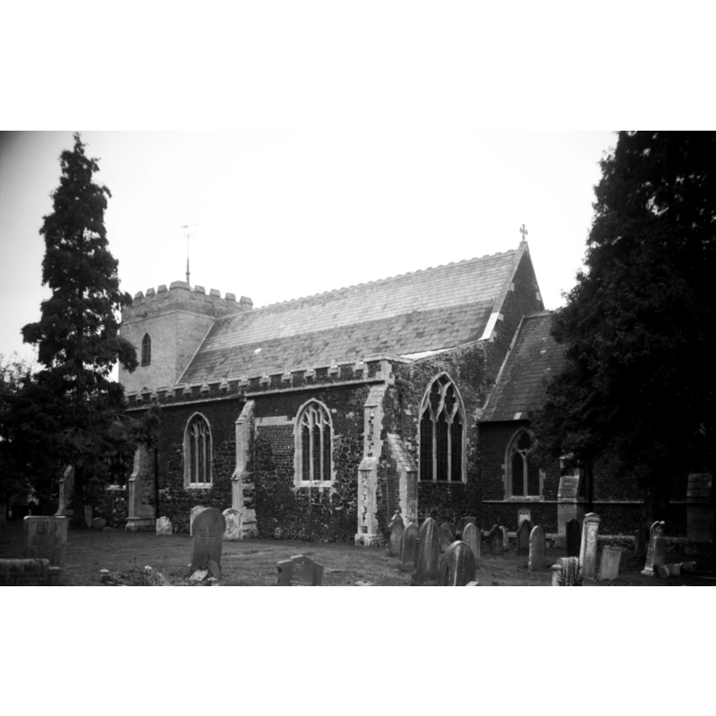photograph caption: "Grey brick tower built 1794. Body of church restored by Street in 1869-70"
