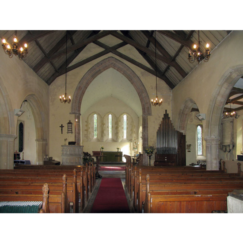 the greyish object at the bottom right-hand [southwest] corner of the nave is the font