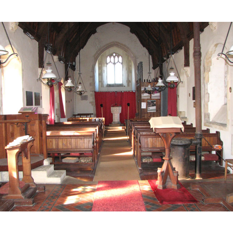 the font and cover at the west end of the nave