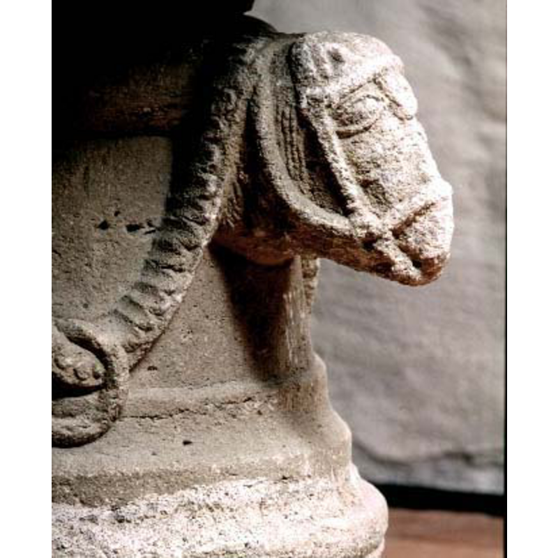 one of the four heads on the base sides