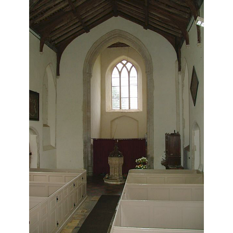 the font and cover at the back (west end)