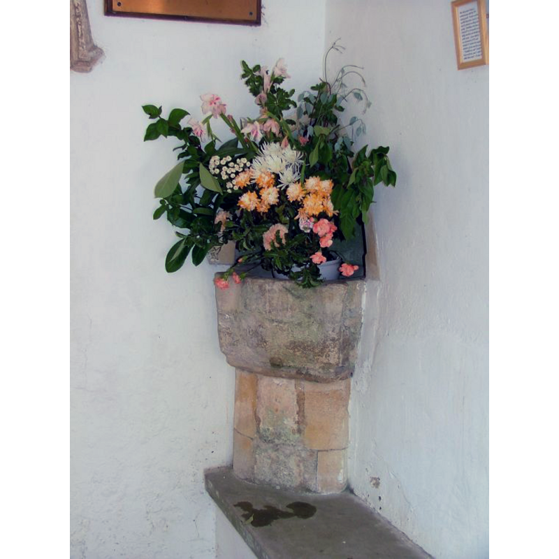 used now as a stoup; was it originally a piscina or a font?