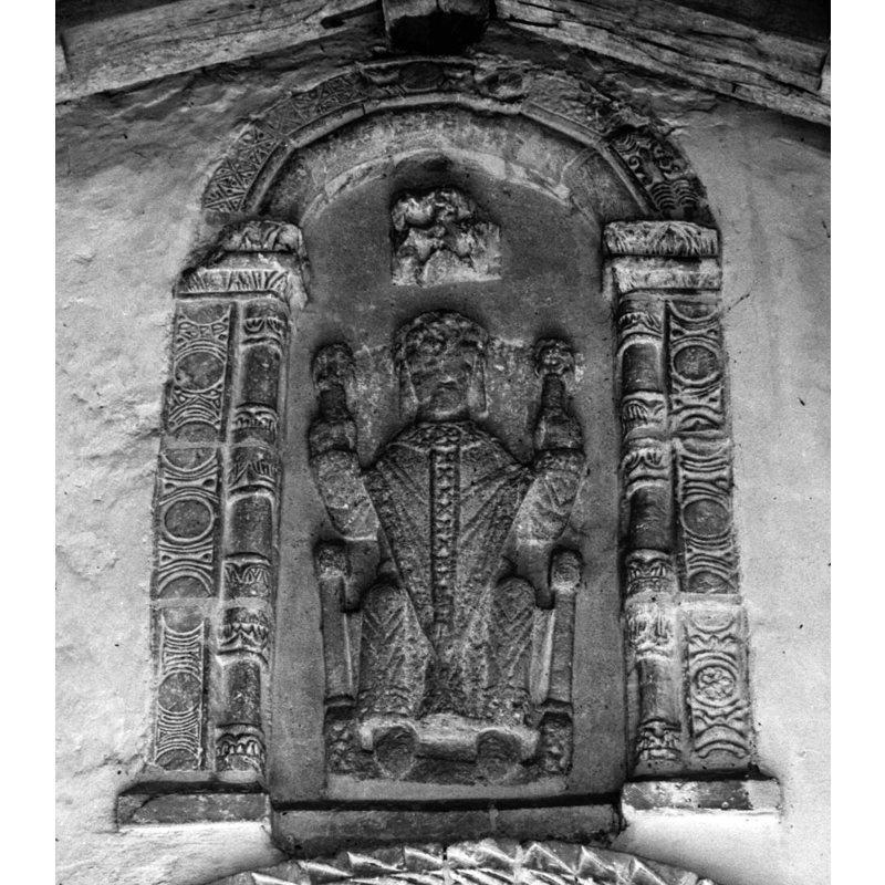 the hieratic figure is often identified as St. Peter, but there are no associated symbols evident to support it