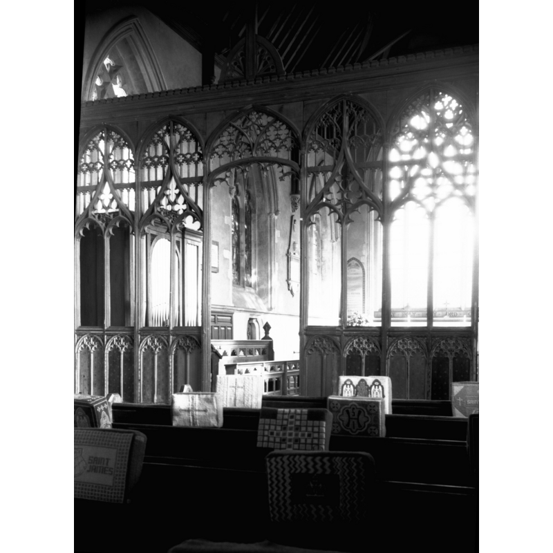 seen from the west side -- Photo caption: "The lower part of coved screen remains, with diapered panels"