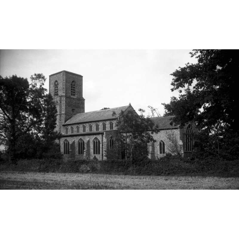 Photo caption: "15c west tower and late 13c chancel"