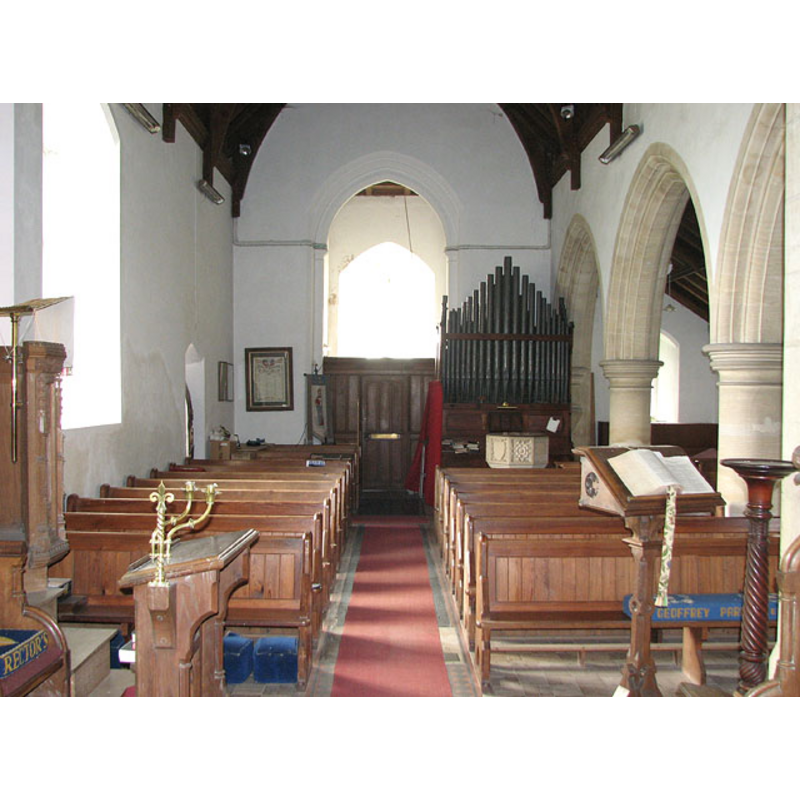 the modern font is partially visible in front of the organ