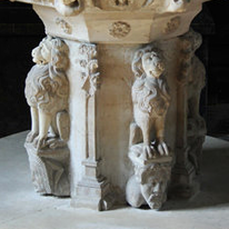 raised on unusual pedestals that are made up of human heads, male and female