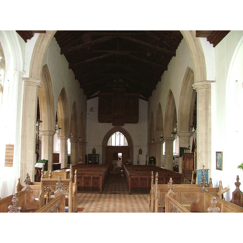 the font is located at the end of the centre aisle, by the west doorway