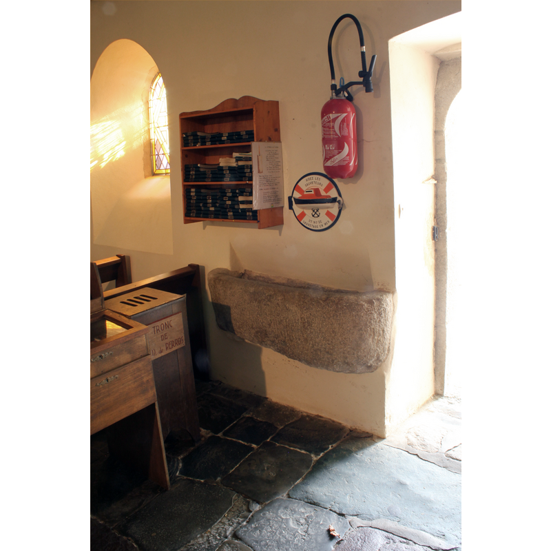 the stoup wall-mounted on the south wall, just east of the south entranceway