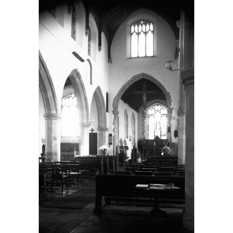 a partial view of the north aisle on the left, across the arcade