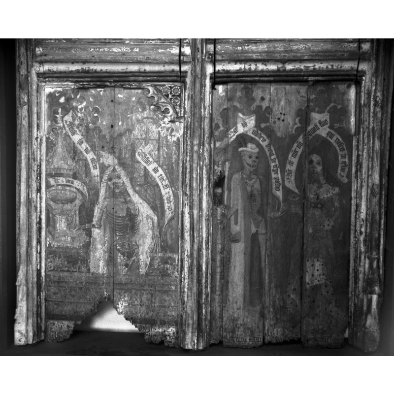 Photo caption: "North aisle 15c screen. Two panels depicting cadavers"