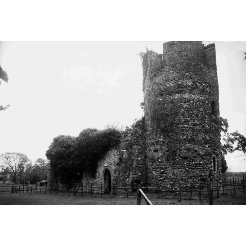 the ruins of St. Mary's -- Photo caption: "It has been a ruin since 1707 when the hall was burnt down and the famous Paston family left the place" -- showing the north entrance, of a much later date than the tower